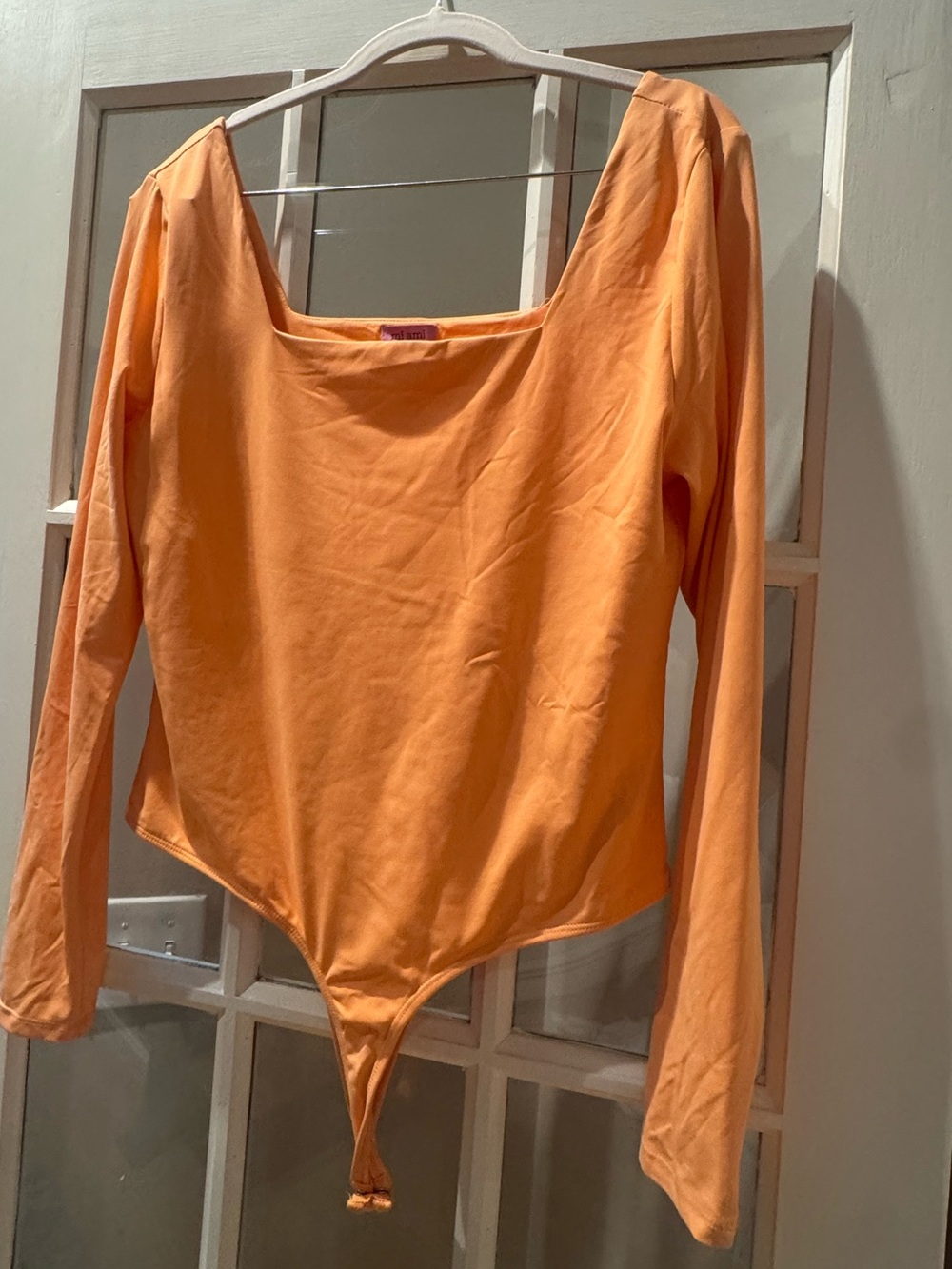 Francesca's Collections Bright Orange Long-Sleeve One-Piece Bodysuit